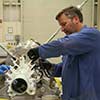 Payload booms being prepared for testing